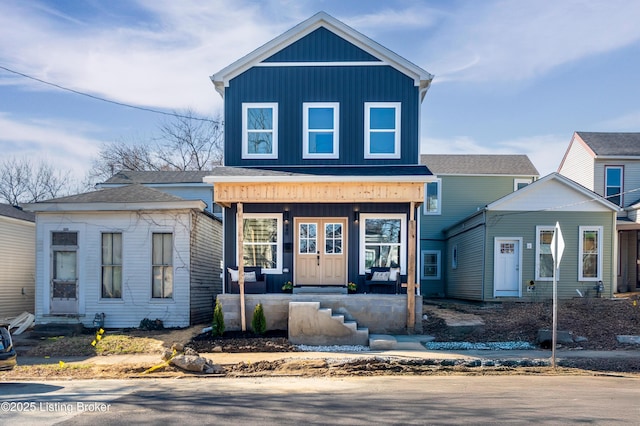 view of front of house featuring board and batten siding and covered porch