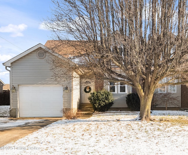 view of front of house with a garage and concrete driveway