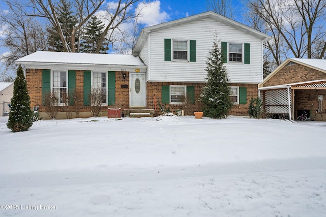 split level home with brick siding