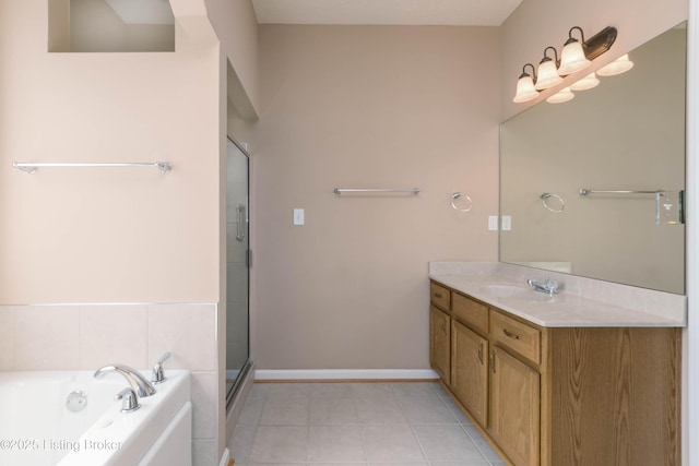 bathroom with vanity, baseboards, a bath, tile patterned floors, and a stall shower