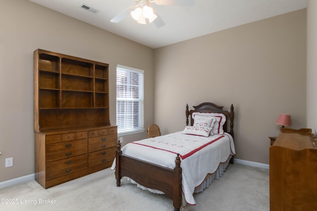 bedroom featuring carpet floors, a ceiling fan, visible vents, and baseboards