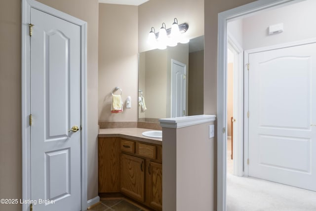 bathroom with tile patterned flooring and vanity