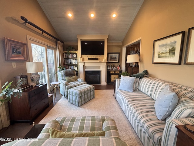 living area featuring a fireplace, high vaulted ceiling, and recessed lighting