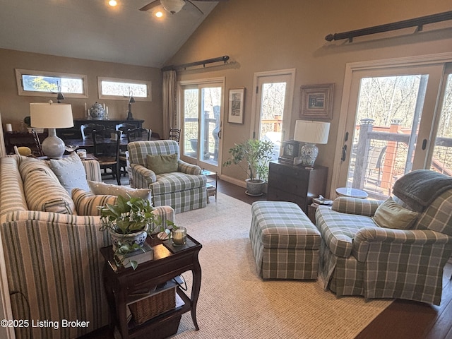 living room featuring lofted ceiling and wood finished floors