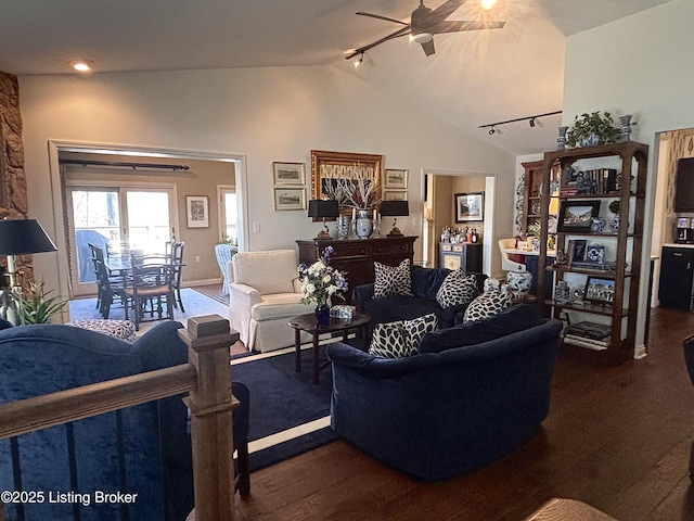 living room featuring ceiling fan, track lighting, vaulted ceiling, and dark wood-type flooring