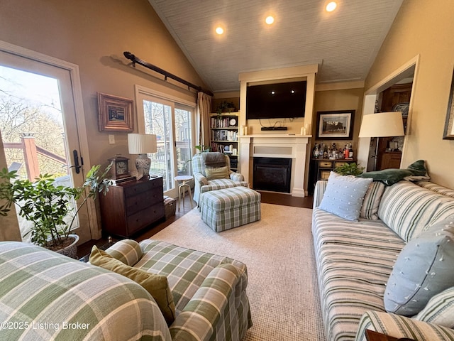 living area with lofted ceiling, a fireplace, and recessed lighting