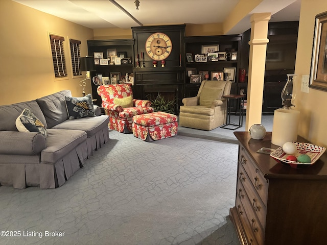 carpeted living room featuring a fireplace