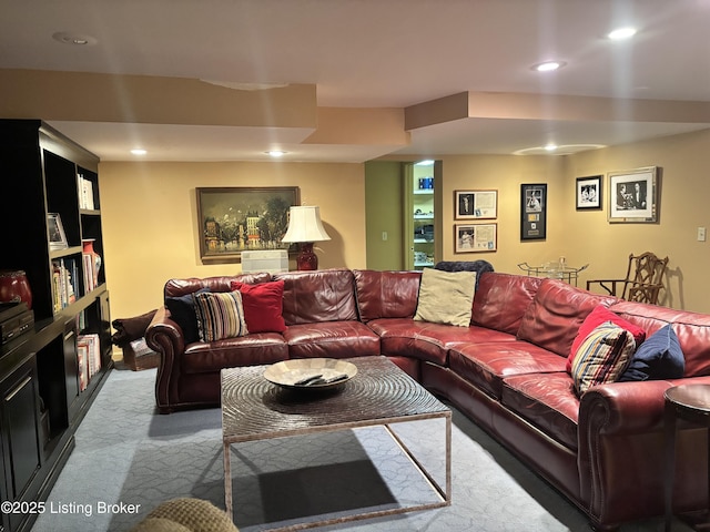 living area featuring recessed lighting and light colored carpet