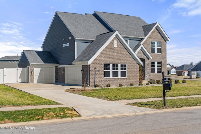 view of front of home featuring concrete driveway, brick siding, a front lawn, and fence