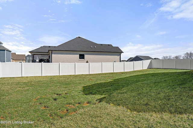 view of yard featuring a fenced backyard