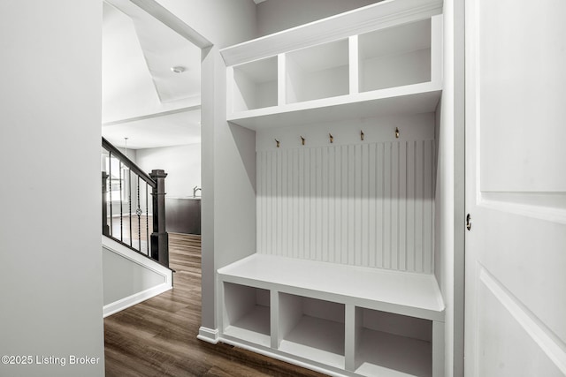 mudroom with wood finished floors and baseboards