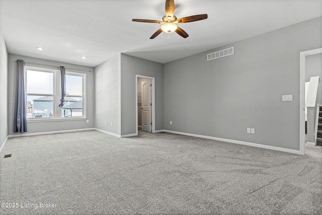 interior space with baseboards, visible vents, and a ceiling fan