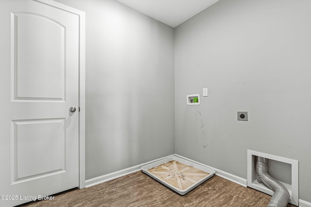 clothes washing area featuring laundry area, baseboards, wood finished floors, hookup for an electric dryer, and washer hookup