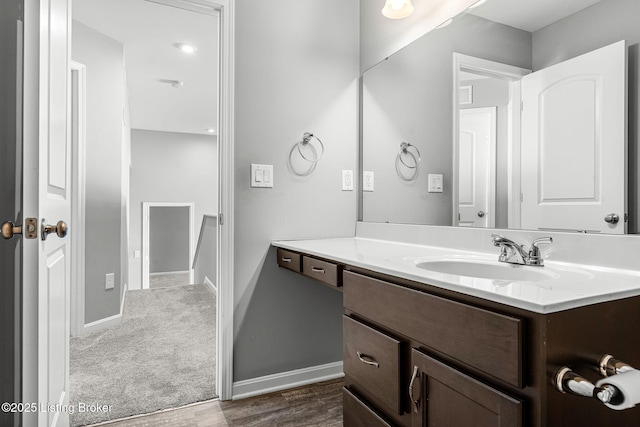 bathroom featuring vanity and baseboards