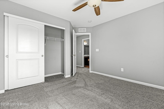 unfurnished bedroom featuring carpet, a closet, visible vents, ceiling fan, and baseboards