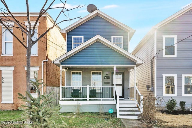 view of front of home featuring covered porch and brick siding