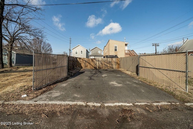 view of yard featuring fence and a gate