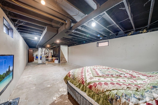 bedroom featuring concrete floors