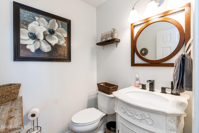 bathroom with toilet and vanity