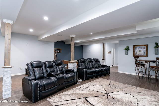 living room featuring recessed lighting, dark wood-style flooring, visible vents, and baseboards