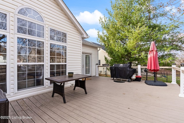 wooden deck with area for grilling