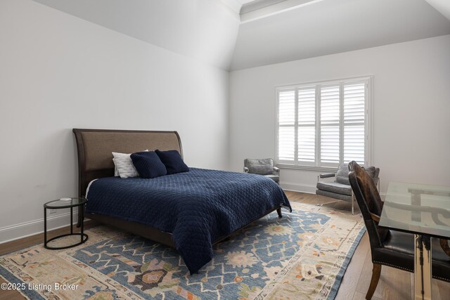 8219 Sutherland Farm Rd, Prospect, KY 40059 - bedroom with vaulted ceiling, baseboards, and wood finished floors