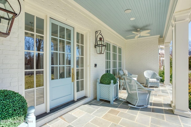 view of patio with a porch and a ceiling fan