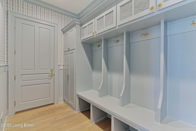 mudroom featuring ornamental molding and light wood-type flooring