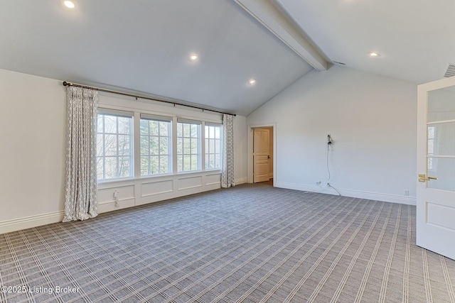 spare room with lofted ceiling with beams, baseboards, visible vents, and light colored carpet