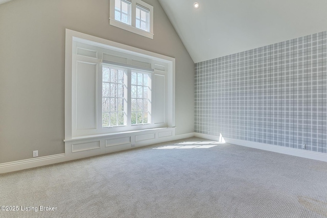 carpeted empty room featuring baseboards, high vaulted ceiling, recessed lighting, and wallpapered walls