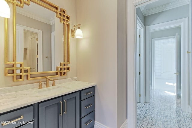 bathroom with crown molding, vanity, and baseboards