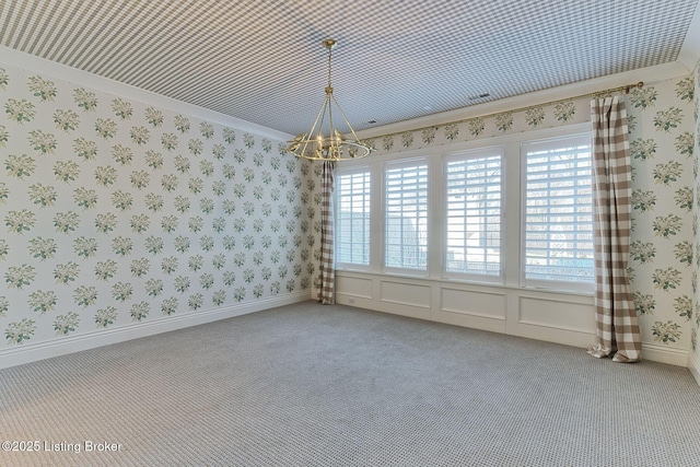 spare room with a healthy amount of sunlight, wallpapered walls, and light colored carpet