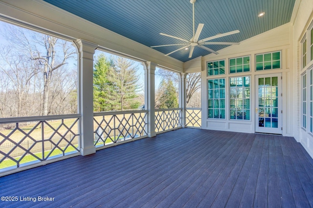 unfurnished sunroom with lofted ceiling, wooden ceiling, and ceiling fan