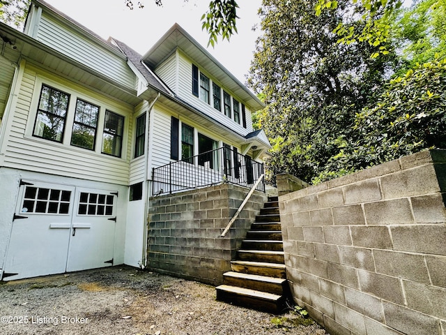 438 S Hite Ave, Louisville, KY 40206 - view of home's exterior with stairway and an attached garage