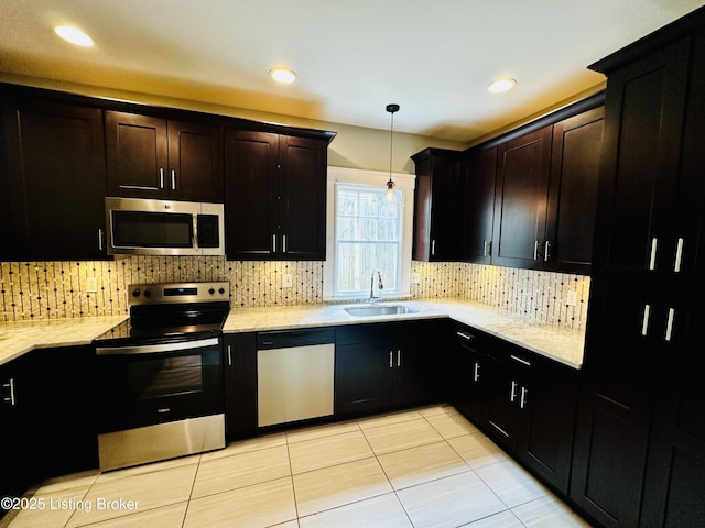 438 S Hite Ave, Louisville, KY 40206 - kitchen featuring stainless steel appliances, backsplash, light stone countertops, and recessed lighting