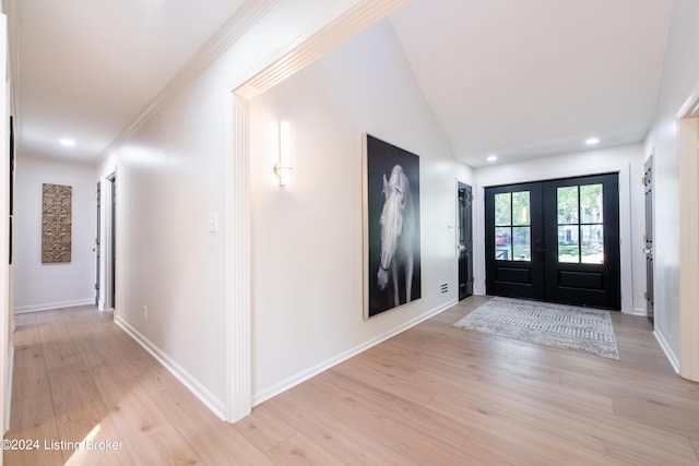 foyer entrance featuring recessed lighting, french doors, baseboards, and light wood finished floors