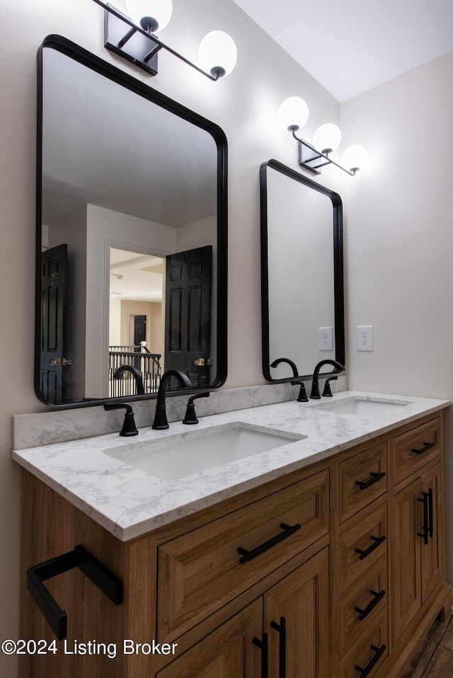 bathroom featuring double vanity and a sink