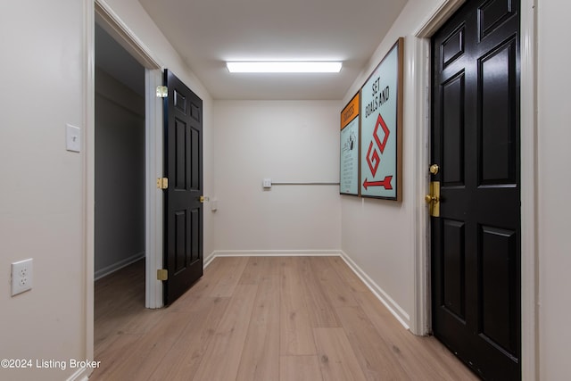 interior space with light wood-type flooring and baseboards