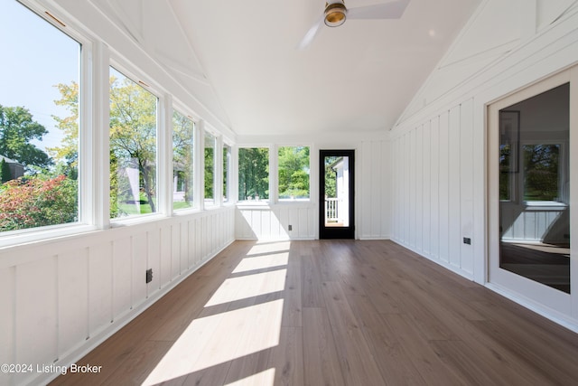 unfurnished sunroom featuring lofted ceiling and a ceiling fan