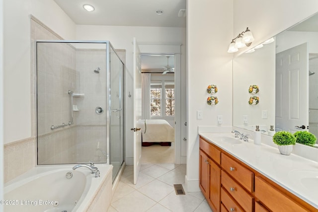 bathroom with double vanity, connected bathroom, a sink, a bath, and tile patterned floors