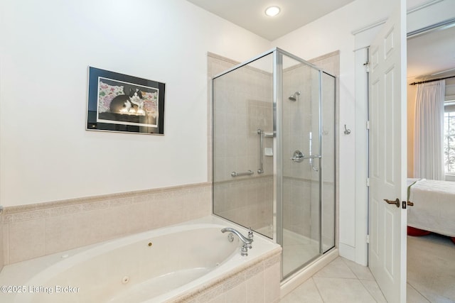 full bath featuring tile patterned floors, a jetted tub, a shower stall, and ensuite bathroom