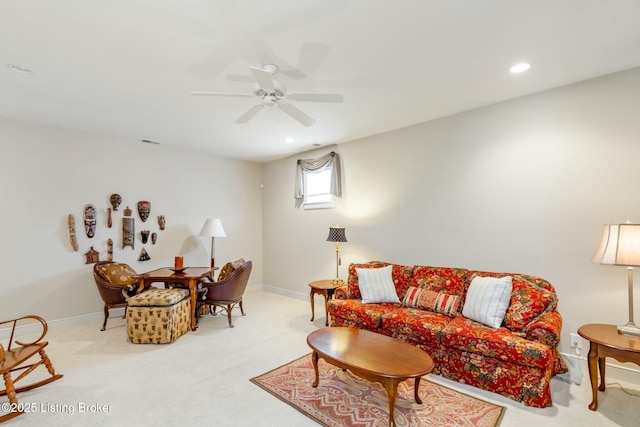 living area featuring light carpet, ceiling fan, recessed lighting, and baseboards