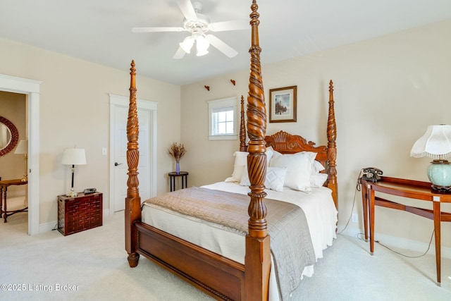 bedroom with light carpet, a ceiling fan, and baseboards