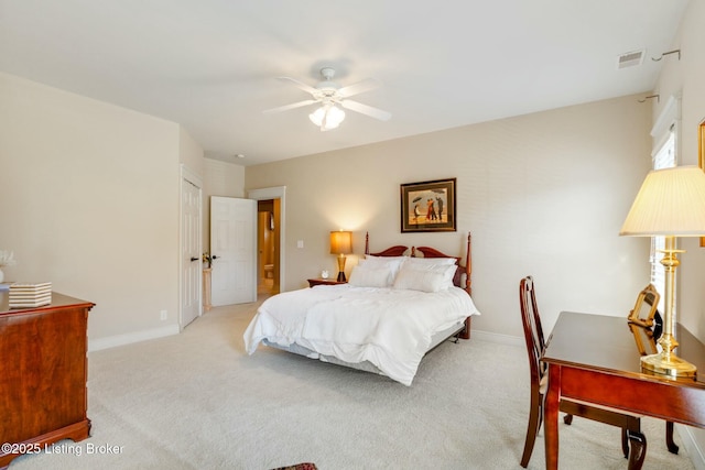 bedroom featuring baseboards, a ceiling fan, visible vents, and light colored carpet