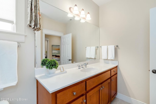 bathroom with baseboards and vanity