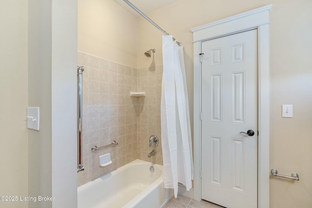 bathroom with shower / bath combo and tile patterned floors