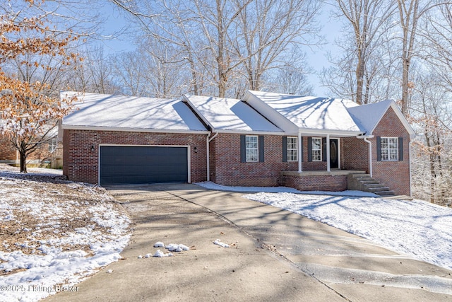 ranch-style home with concrete driveway, brick siding, and an attached garage