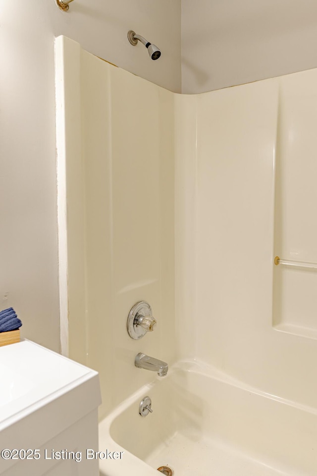 bathroom featuring shower / bathing tub combination and vanity