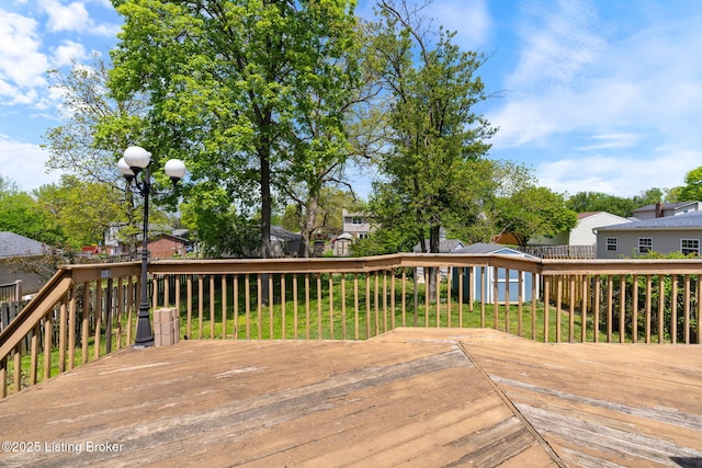 10207 El Coco Ct, Louisville, KY 40291 - wooden deck featuring a storage shed, a residential view, and a lawn