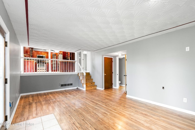 10207 El Coco Ct, Louisville, KY 40291 - spare room featuring stairs and light wood finished floors